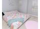 Cozy bedroom featuring a bed with colorful donut-patterned bedding and natural light at 414 Taft Dr, Davenport, FL 33837
