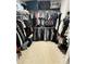 Walk-in closet featuring extensive hanging space and storage for clothing, shoes, and accessories at 414 Taft Dr, Davenport, FL 33837