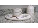 Close-up of the countertop decor, with modern mugs and a 'dog treats' jar at 414 Taft Dr, Davenport, FL 33837
