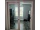 Exercise room featuring glass french doors, fitness equipment, ceiling fan, and natural light at 414 Taft Dr, Davenport, FL 33837