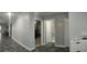 Spacious hallway featuring ceramic tile floors, neutral paint, and access to bedrooms and bathrooms at 414 Taft Dr, Davenport, FL 33837