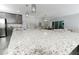 Close-up view of the kitchen's island, highlighting the granite countertops and stylish fixtures at 414 Taft Dr, Davenport, FL 33837