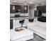 Modern kitchen featuring dark cabinetry, granite countertops, and stainless steel appliances at 414 Taft Dr, Davenport, FL 33837