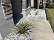 Close up of landscaping including gray gravel, stone accents, and small palm trees at 414 Taft Dr, Davenport, FL 33837