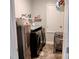 Well-organized laundry room with modern washer and dryer units, utility sink and ample storage for laundry essentials at 414 Taft Dr, Davenport, FL 33837