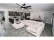 A spacious living room with an open floor plan featuring a large sectional sofa at 414 Taft Dr, Davenport, FL 33837