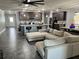 Open-concept living room featuring large kitchen island, stainless appliances, and seating area at 414 Taft Dr, Davenport, FL 33837