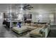 Open-concept living room with large kitchen island, stainless appliances, and a spacious seating area at 414 Taft Dr, Davenport, FL 33837