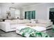 Cozy living room featuring a large sectional sofa, stylish decor, and lots of natural light at 414 Taft Dr, Davenport, FL 33837
