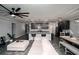 Open living area with a modern kitchen island, comfortable seating, and contemporary decor at 414 Taft Dr, Davenport, FL 33837