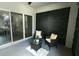 Relaxing covered patio with neutral decor, backyard view, and natural light at 414 Taft Dr, Davenport, FL 33837