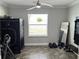 Versatile room featuring tile flooring, a ceiling fan, and a large window providing ample natural light at 414 Taft Dr, Davenport, FL 33837