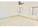 Bright bedroom with tile flooring and neutral wall color at 434 Acacia Tree Way, Kissimmee, FL 34758