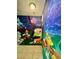 Hallway with Disney-themed murals, adding a unique and playful touch to the home's interior at 434 Acacia Tree Way, Kissimmee, FL 34758