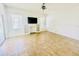 Bright living room with built in shelves, decorative fireplace, and tile flooring at 434 Acacia Tree Way, Kissimmee, FL 34758