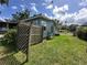 View of the property's backyard with fence at 55808 Nan Dr, Astor, FL 32102