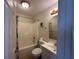Bathroom with neutral tones, featuring a shower-tub combination and a vanity sink at 55808 Nan Dr, Astor, FL 32102