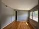 Bedroom with hardwood floors, neutral walls, and a window for natural light at 55808 Nan Dr, Astor, FL 32102