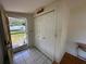 Bright entryway featuring tile floors and closet with boat view outside the door at 55808 Nan Dr, Astor, FL 32102