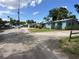 Charming light blue single-story home with lovely landscaping and ample parking at 55808 Nan Dr, Astor, FL 32102