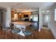 Modern kitchen with stainless steel appliances, breakfast bar, and tile floors at 55808 Nan Dr, Astor, FL 32102
