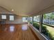 Bright and spacious living room with hardwood floors and waterfront views at 55808 Nan Dr, Astor, FL 32102