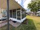 Enclosed patio overlooking the yard at 55808 Nan Dr, Astor, FL 32102