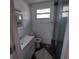Updated bathroom, featuring a walk-in shower and modern vanity at 645 Cherry St, Daytona Beach, FL 32114