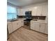Modern kitchen with stainless steel appliances at 645 Cherry St, Daytona Beach, FL 32114