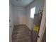 Laundry room with new water heater and vinyl flooring at 645 Cherry St, Daytona Beach, FL 32114