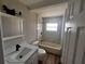 Tastefully renovated bathroom featuring modern fixtures, marble tiling and an updated vanity at 708 Wynn Dr, Sanford, FL 32773