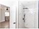 Modern bathroom boasts a glass walk-in shower with stunning marble-style tile and sleek black fixtures at 708 Wynn Dr, Sanford, FL 32773