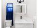 Bathroom featuring a modern vanity, marble countertop, black faucet, and updated fixtures at 708 Wynn Dr, Sanford, FL 32773