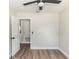 Bedroom features neutral walls, wood-look flooring, and a modern ceiling fan for ultimate comfort at 708 Wynn Dr, Sanford, FL 32773