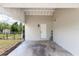Spacious carport providing covered parking with access to the backyard and featuring brick perimeter at 708 Wynn Dr, Sanford, FL 32773