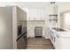 Newly renovated kitchen boasting stainless steel appliances, white cabinetry, and stunning countertop at 708 Wynn Dr, Sanford, FL 32773