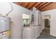 Laundry room features a washer, dryer, and utility sink, providing convenience and functionality at 708 Wynn Dr, Sanford, FL 32773
