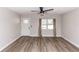 Bright and airy living room highlighting modern flooring, neutral paint, and natural light through the window at 708 Wynn Dr, Sanford, FL 32773