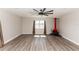Spacious living room with stylish, modern flooring, vintage fireplace, and large window with natural light at 708 Wynn Dr, Sanford, FL 32773