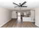Open-concept living space showcasing modern flooring, updated lighting, and seamless flow to the adjacent kitchen at 708 Wynn Dr, Sanford, FL 32773