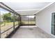 A relaxing screened porch area with concrete floor and ample natural light overlooking the backyard at 708 Wynn Dr, Sanford, FL 32773