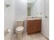 Neat bathroom with wood vanity and tiled floor at 7654 Sugar Bend Dr # 7654, Orlando, FL 32819