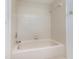 Clean bathtub with beige tile surround at 7654 Sugar Bend Dr # 7654, Orlando, FL 32819