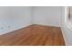 Spacious bedroom featuring wood flooring and a window at 7654 Sugar Bend Dr # 7654, Orlando, FL 32819