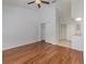 Bedroom with hardwood floors and double door closets at 7654 Sugar Bend Dr # 7654, Orlando, FL 32819