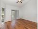 Bright bedroom with wood flooring and access to a private balcony at 7654 Sugar Bend Dr # 7654, Orlando, FL 32819