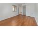 Well-lit bedroom with wood flooring and closet at 7654 Sugar Bend Dr # 7654, Orlando, FL 32819