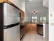 Kitchen with stainless steel appliances and wood cabinets at 7654 Sugar Bend Dr # 7654, Orlando, FL 32819