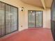 Screened lanai with sliding glass doors and ceiling fan at 7654 Sugar Bend Dr # 7654, Orlando, FL 32819
