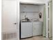 Convenient laundry room with washer and dryer at 7654 Sugar Bend Dr # 7654, Orlando, FL 32819